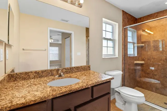 a bathroom that has a window in it