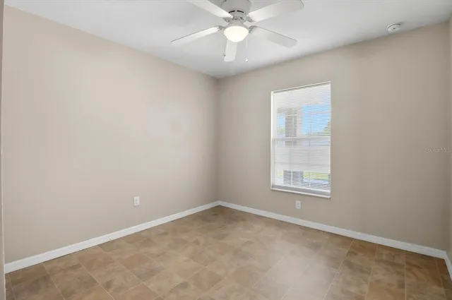 an empty room with closet area