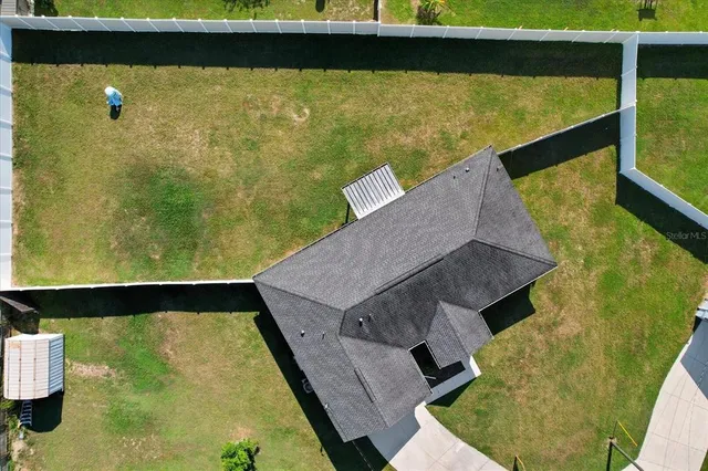 a swimming pool with lawn chairs