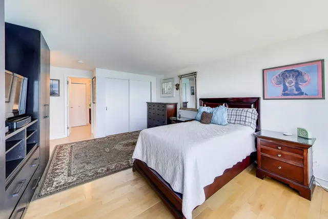 a bathroom with a double vanity sink toilet and shower