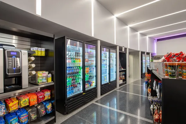 a view of an empty room with a fireplace