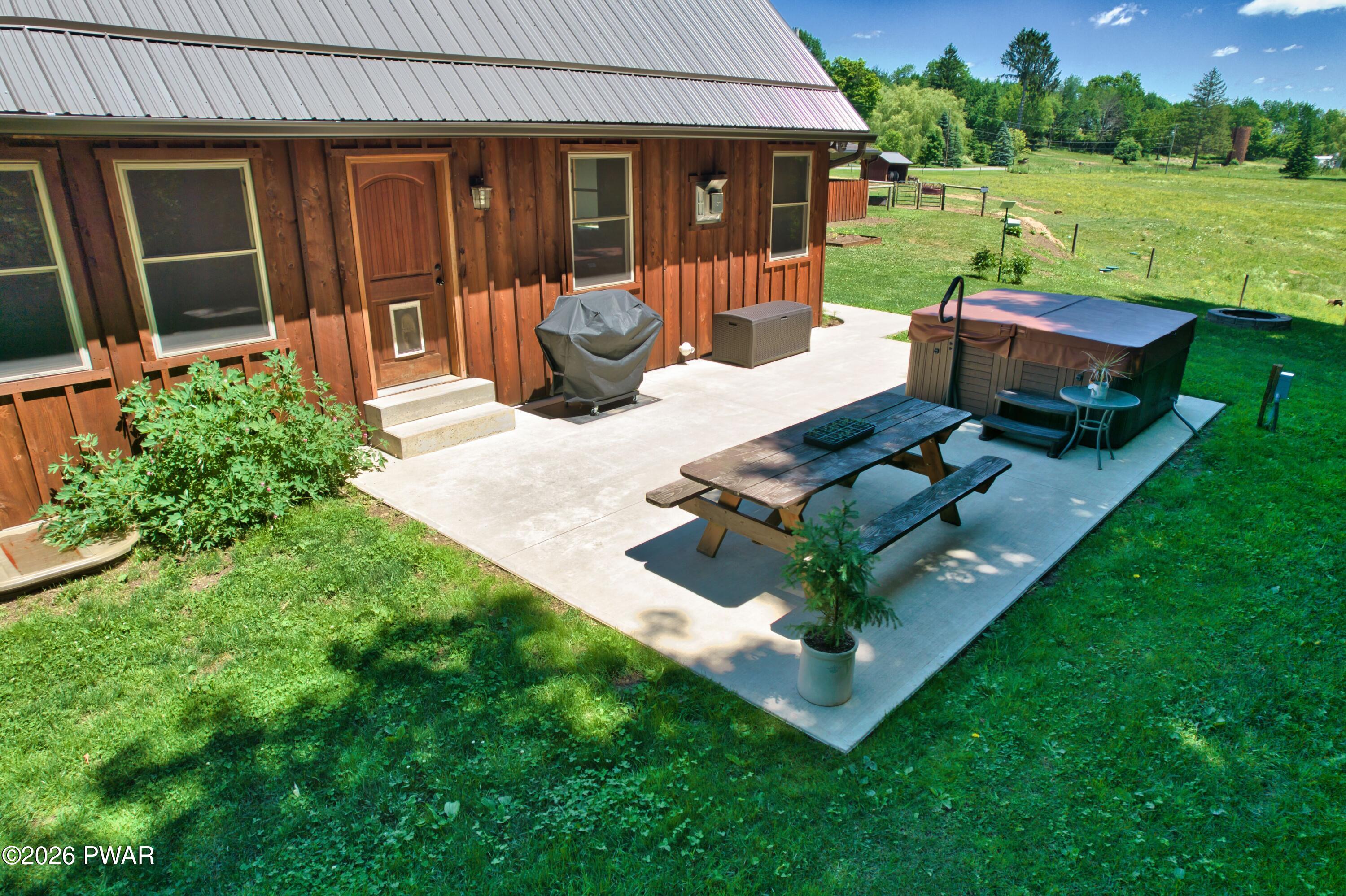 149 Sheards Road Milanville, PA 18443 - Photo 9 of 57 a view of a backyard with couches plants and large tree
