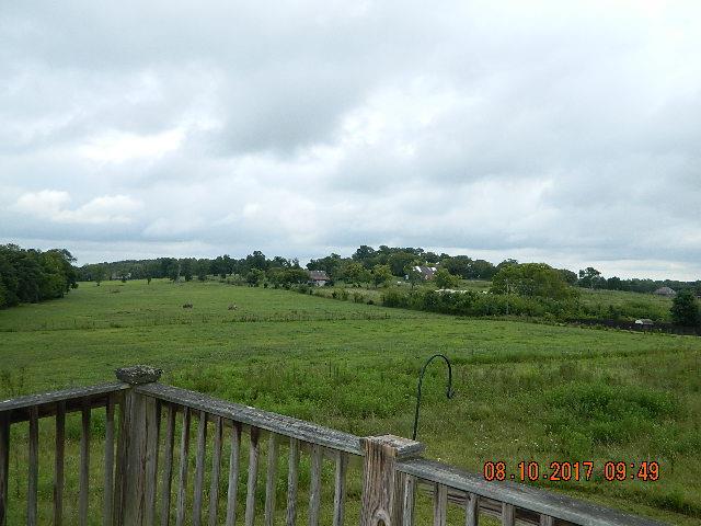 1052 Sugar Flat Road Lebanon, TN 37087 - Photo 7 of 27 a view of a lush green yard with wooden fence