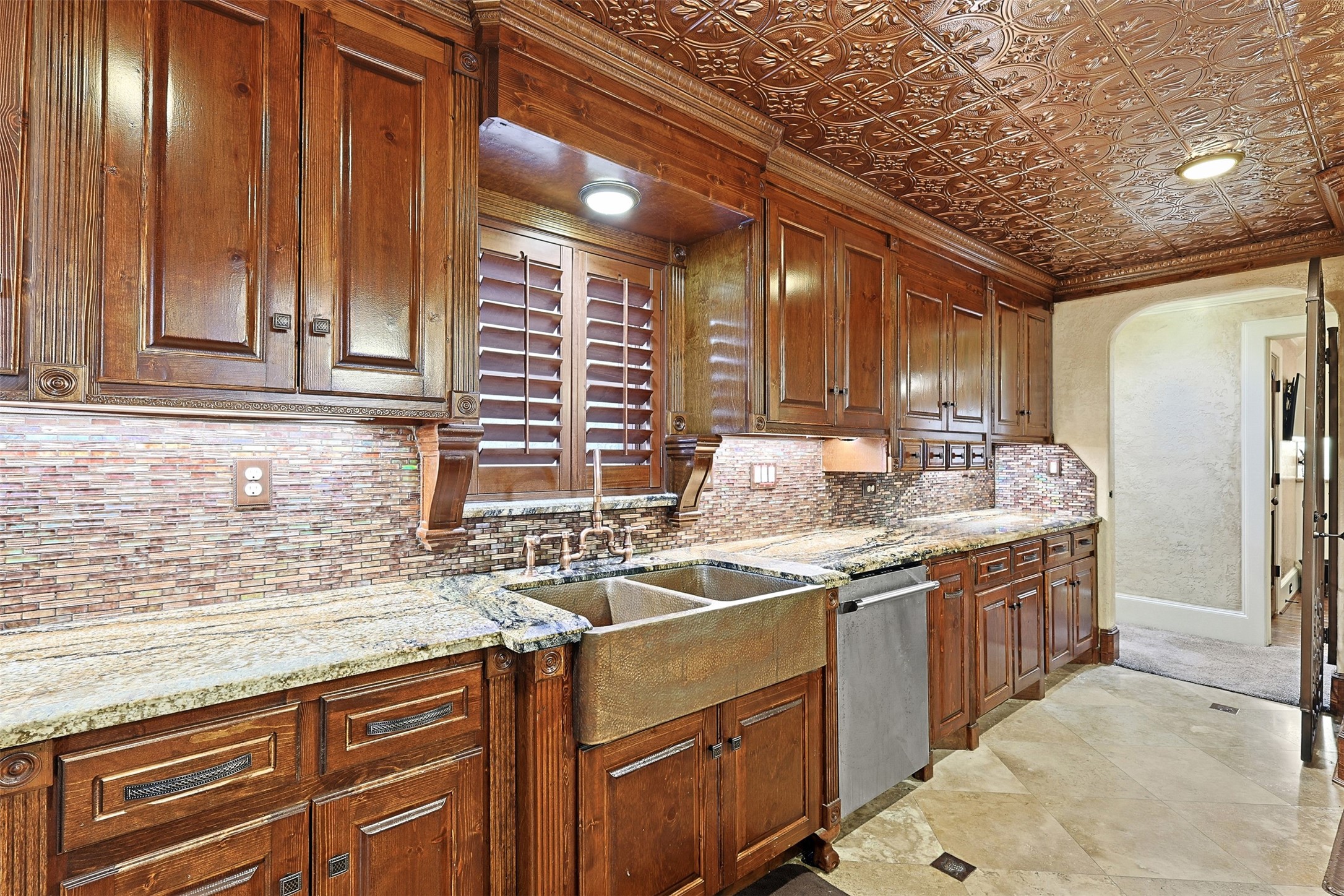 3543 Rosedale Street Houston, TX 77004 - Photo 11 of 37 a kitchen with stainless steel appliances granite countertop a sink and a refrigerator