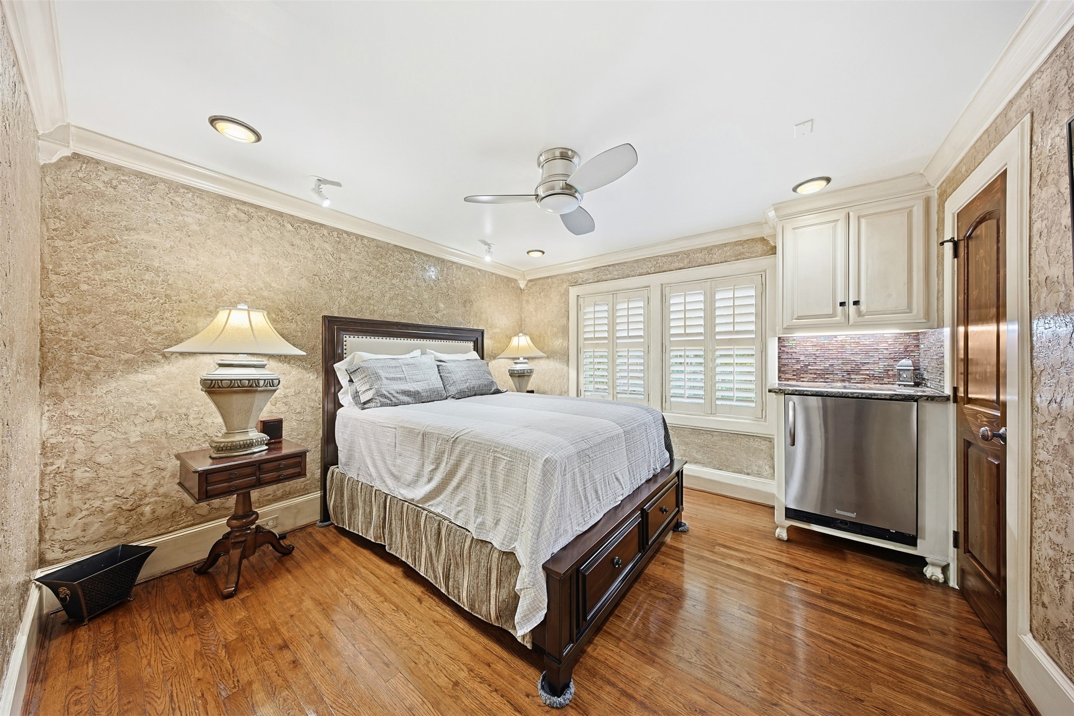 3543 Rosedale Street Houston, TX 77004 - Photo 21 of 37 a bedroom with a bed and wooden floor