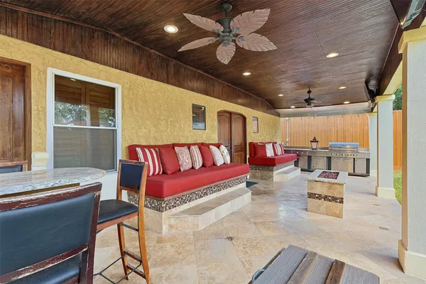 a living room with furniture and kitchen view