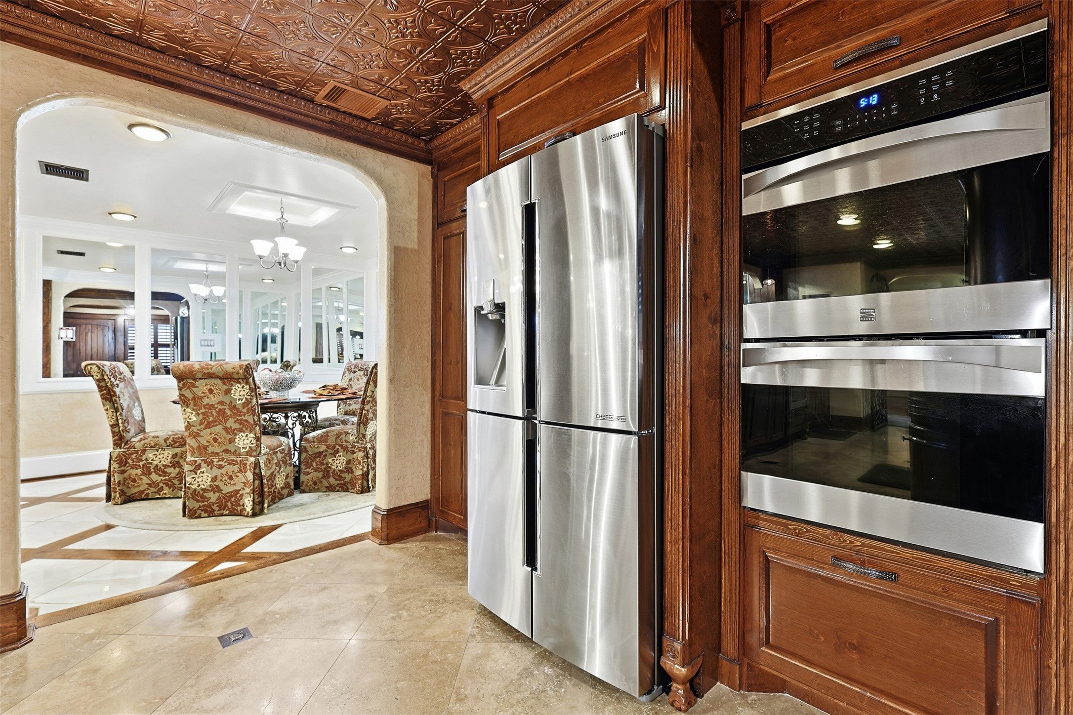 3543 Rosedale Street Houston, TX 77004 - Photo 9 of 37 a view of a hallway with dining area and chandelier