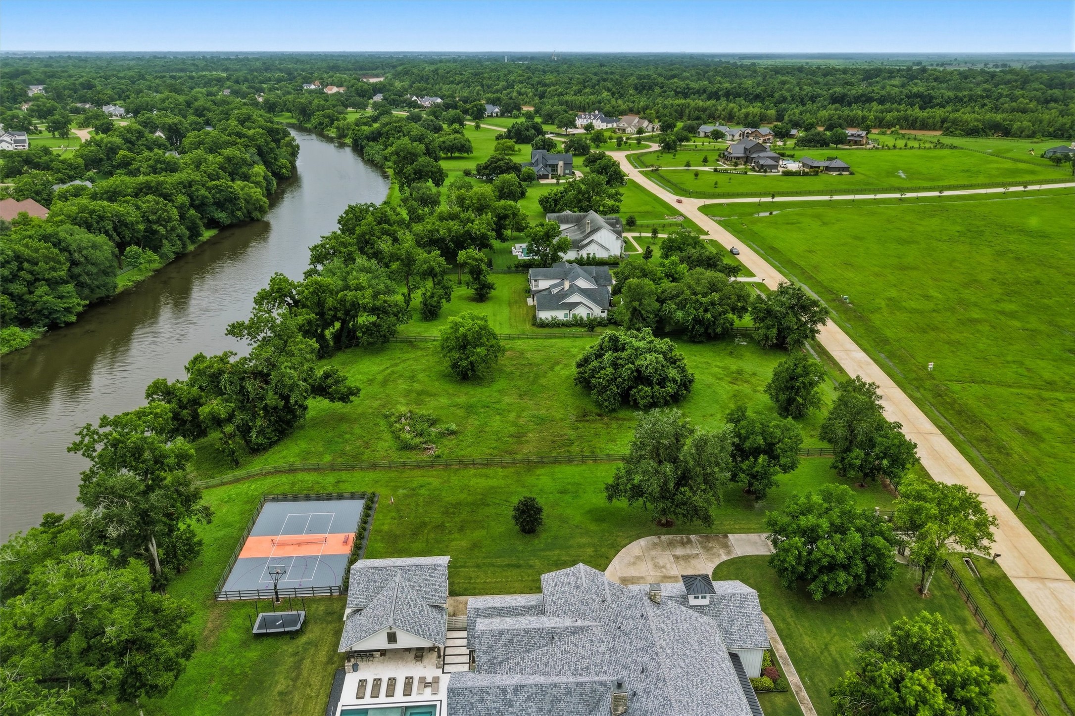 0 Riverlake Road Fulshear, TX 77441 - Photo 37 of 47 Perfectly positioned along the river, this extraordinary homesite offers breathtaking water views and abundant privacy. The spectacular setting provides the ideal canvas for designing a custom estate that seamlessly blends luxury living with nature.