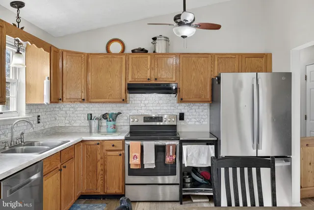 a bedroom with furniture and a baby crib