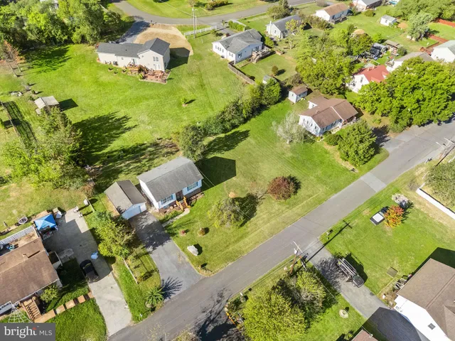 a view of a house with backyard porch and sitting area
