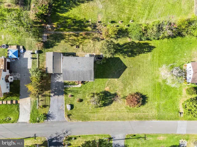 a view of a house with backyard sitting area and garden