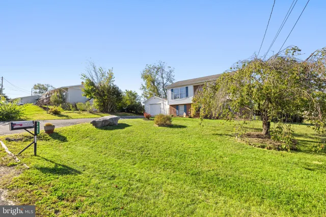 a swimming pool with an outdoor space and seating area