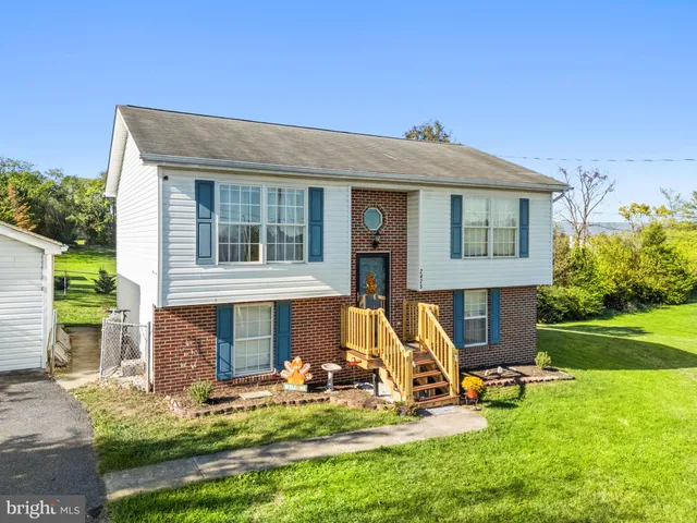 a view of a house with a big yard