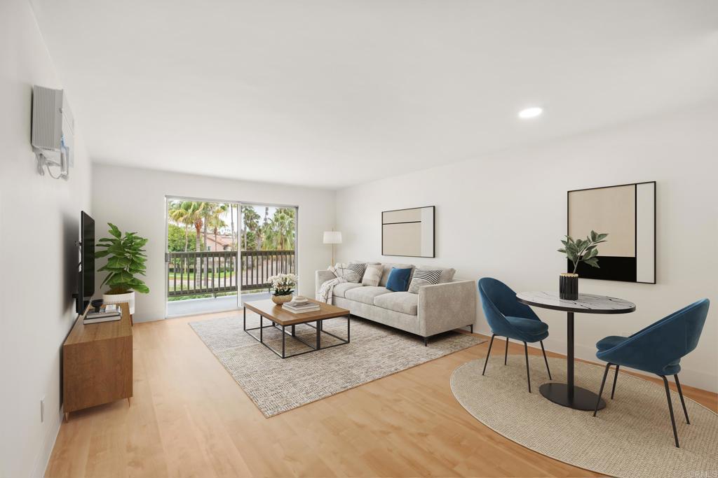 a living room with furniture large window and flat screen tv