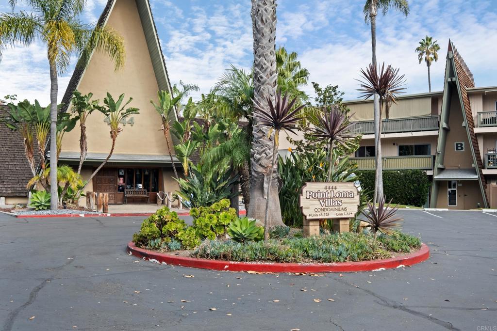 4444 West Point Loma Boulevard, Unit 122 San Diego, CA 92107 - Photo 20 of 25 a front view of a house with a garden