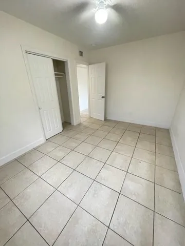 a view of an empty room and entryway