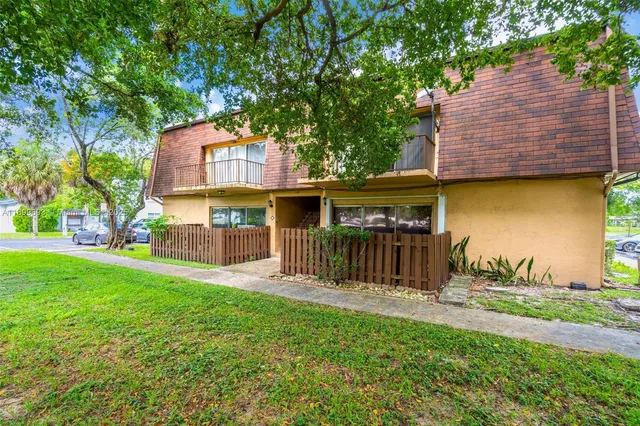 a front view of house with yard and outdoor seating
