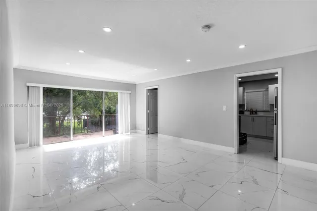 a view of entryway with kitchen