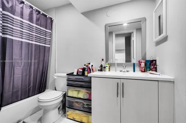 a view of kitchen with furniture and clutter