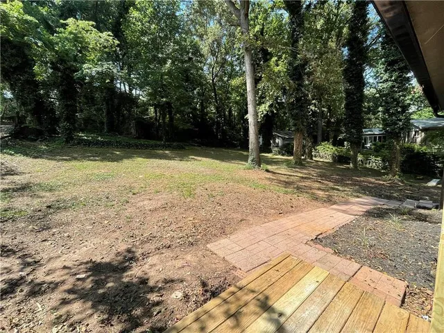a view of a backyard with trees