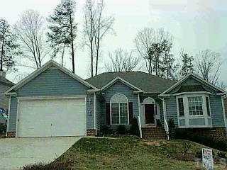 11616 Shavenrock Place Raleigh, NC 27613 - Photo 1 of 1 a front view of a house with garden