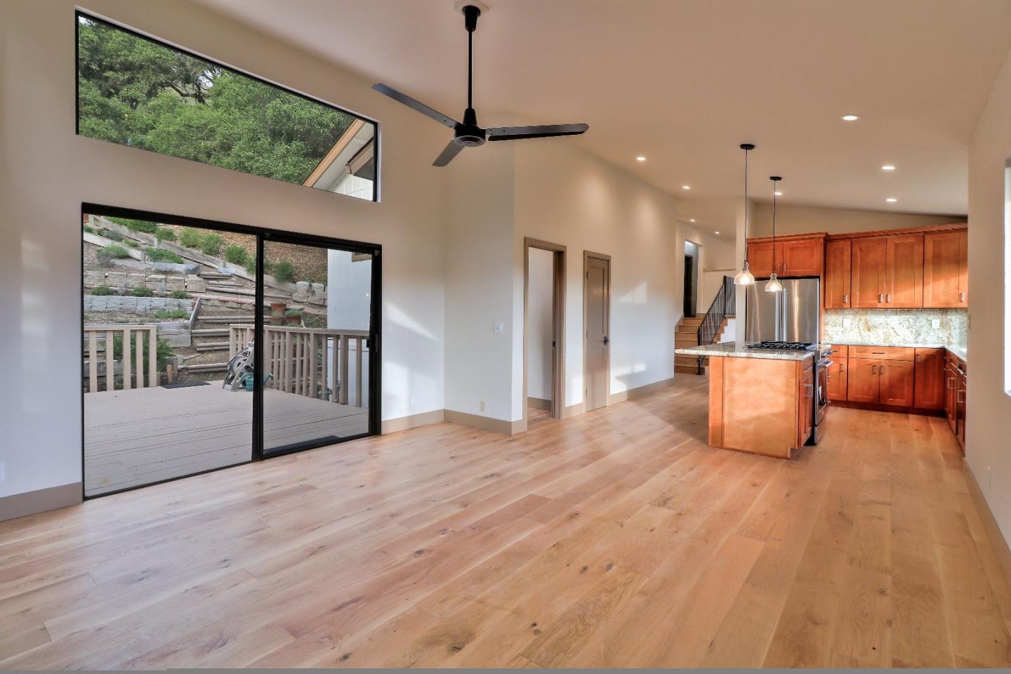 11551 Hidden Valley Road Carmel Valley, CA 93924 - Photo 15 of 33 a view of empty room with wooden floor and windows