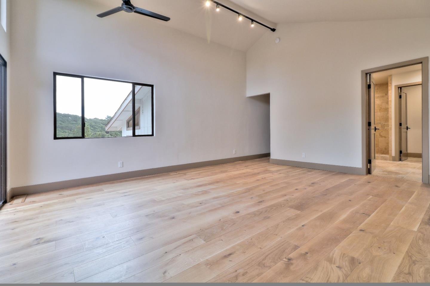 11551 Hidden Valley Road Carmel Valley, CA 93924 - Photo 19 of 33 a view of an empty room with a window