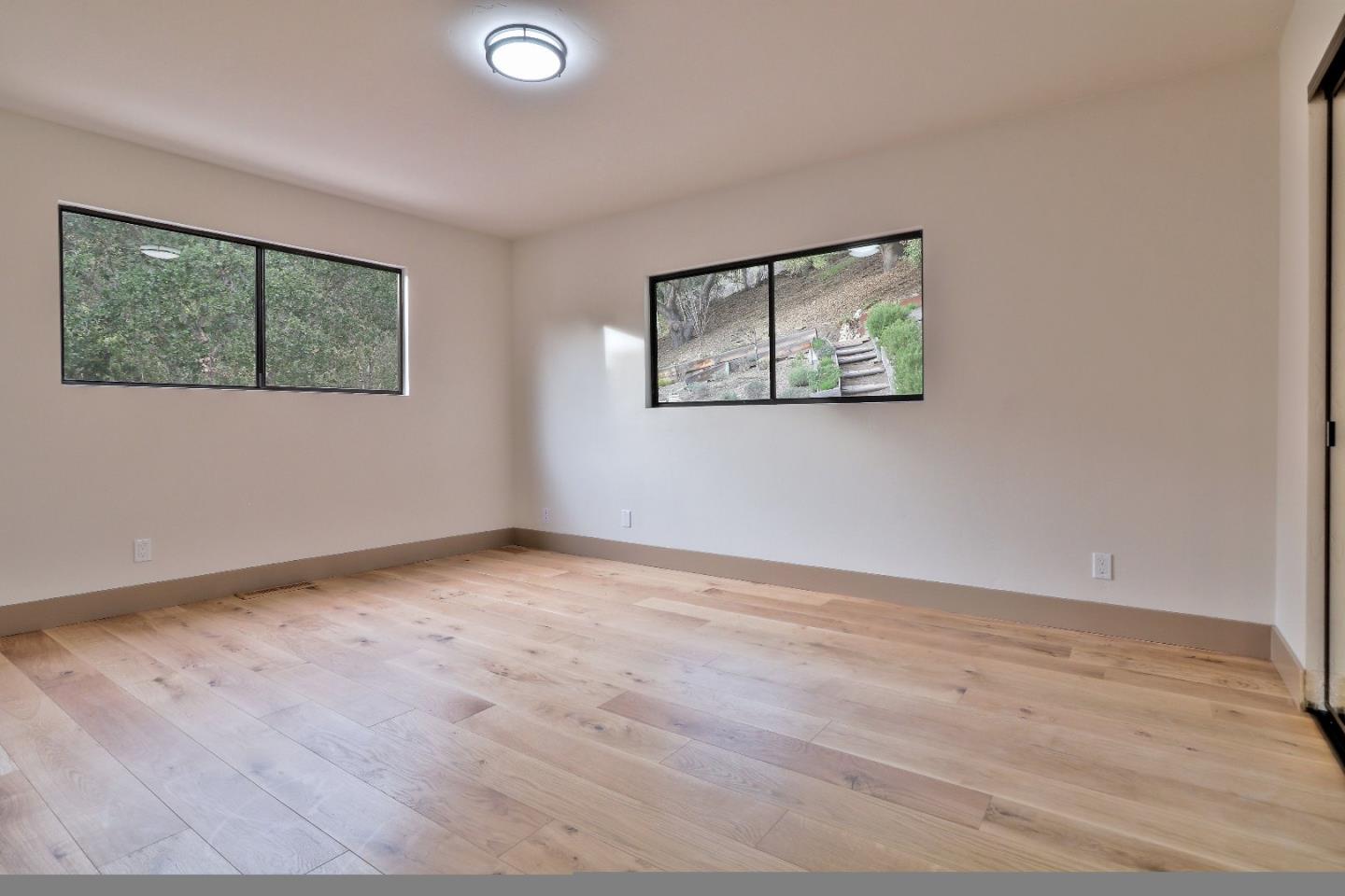 11551 Hidden Valley Road Carmel Valley, CA 93924 - Photo 22 of 33 a view of an empty room with a window
