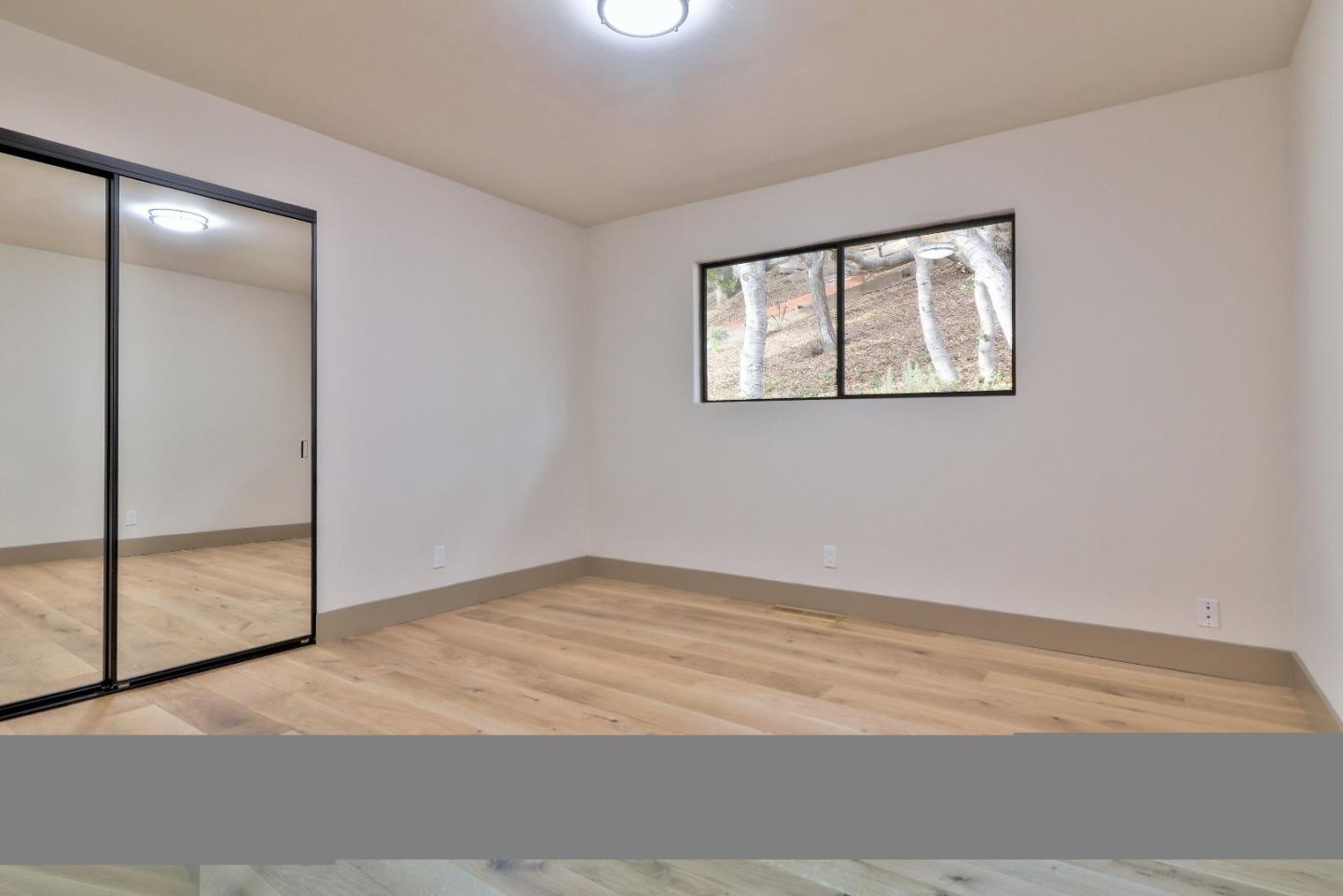 11551 Hidden Valley Road Carmel Valley, CA 93924 - Photo 24 of 33 an empty room with window