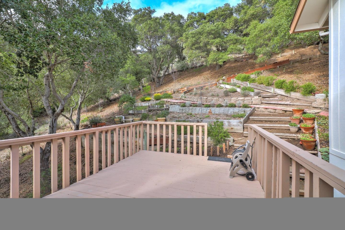 11551 Hidden Valley Road Carmel Valley, CA 93924 - Photo 30 of 33 a view of a balcony with wooden floor and fence
