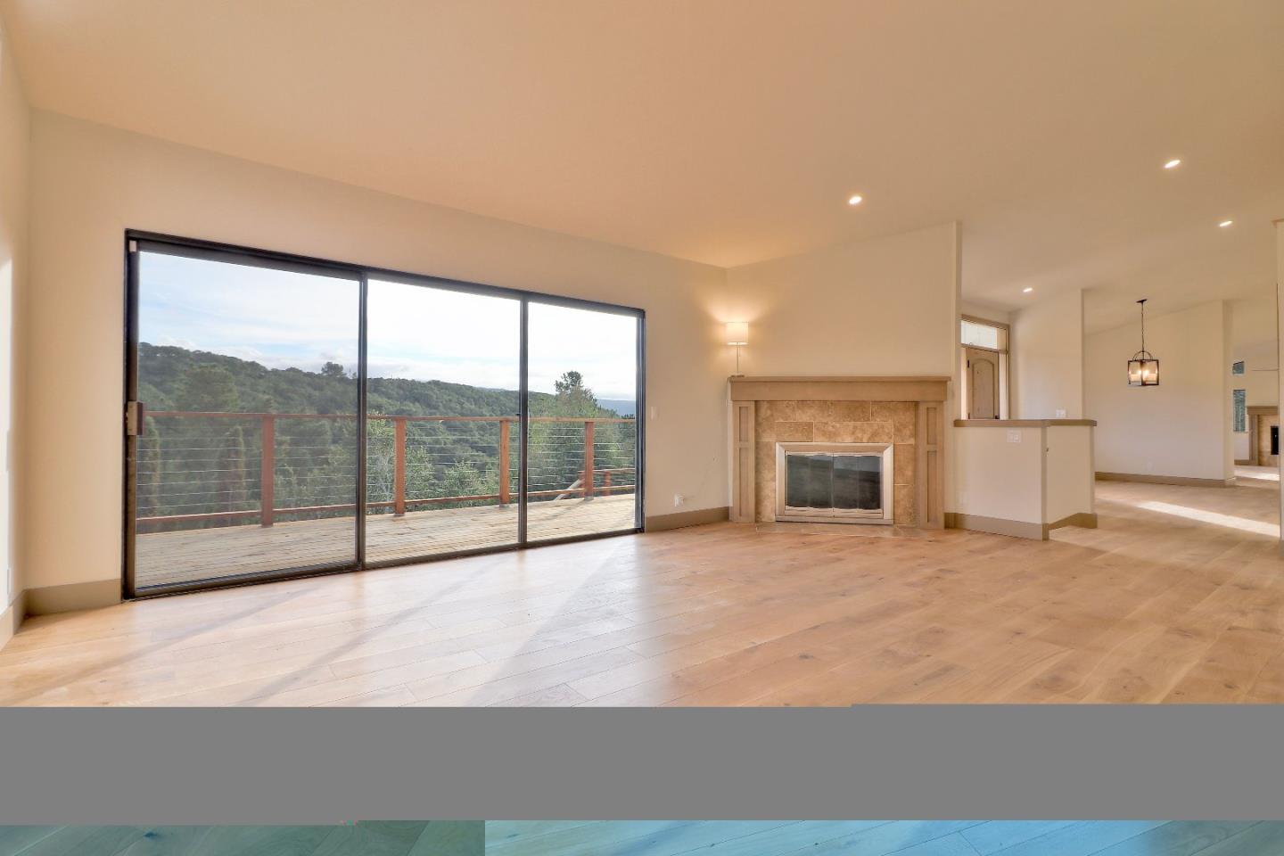 11551 Hidden Valley Road Carmel Valley, CA 93924 - Photo 7 of 33 a view of empty room with a fireplace