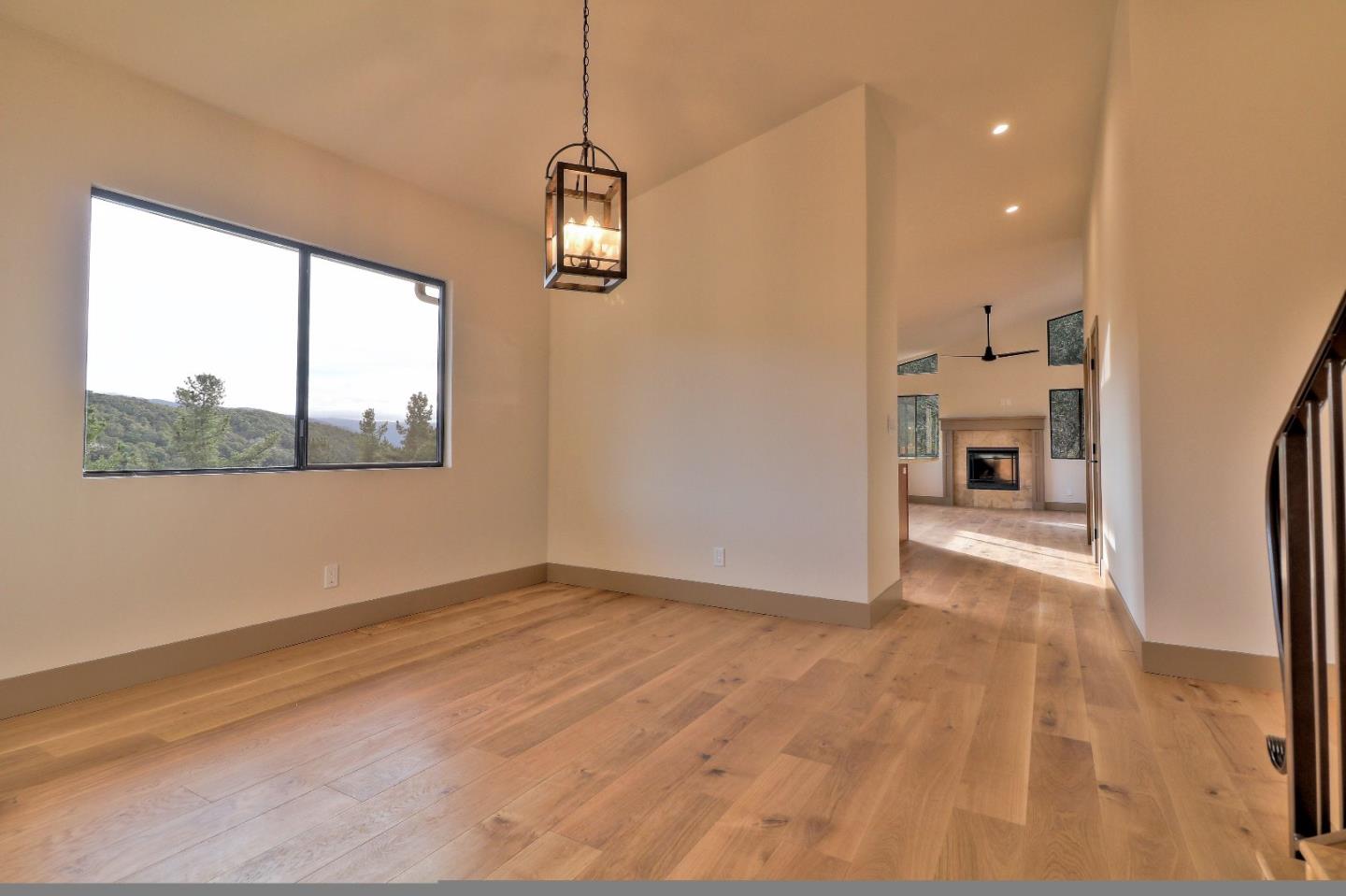 11551 Hidden Valley Road Carmel Valley, CA 93924 - Photo 8 of 33 a view of empty room with wooden floor and window