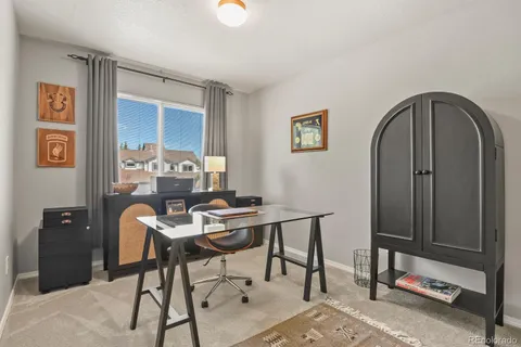 a workspace with furniture and window
