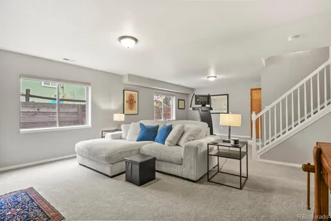 a living room with furniture and a table