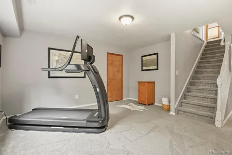 a living room with stairs