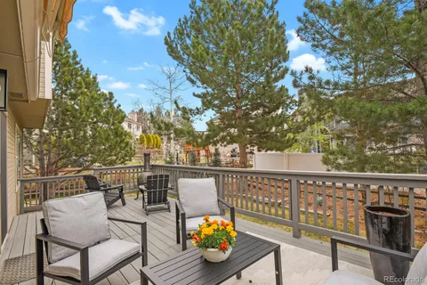 a view of a balcony with chairs