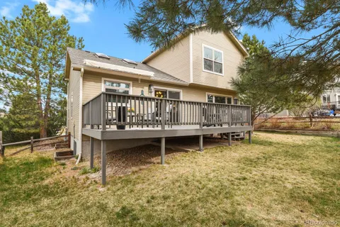 a small house with outdoor seating area