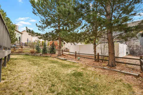 a view of a yard with swimming pool