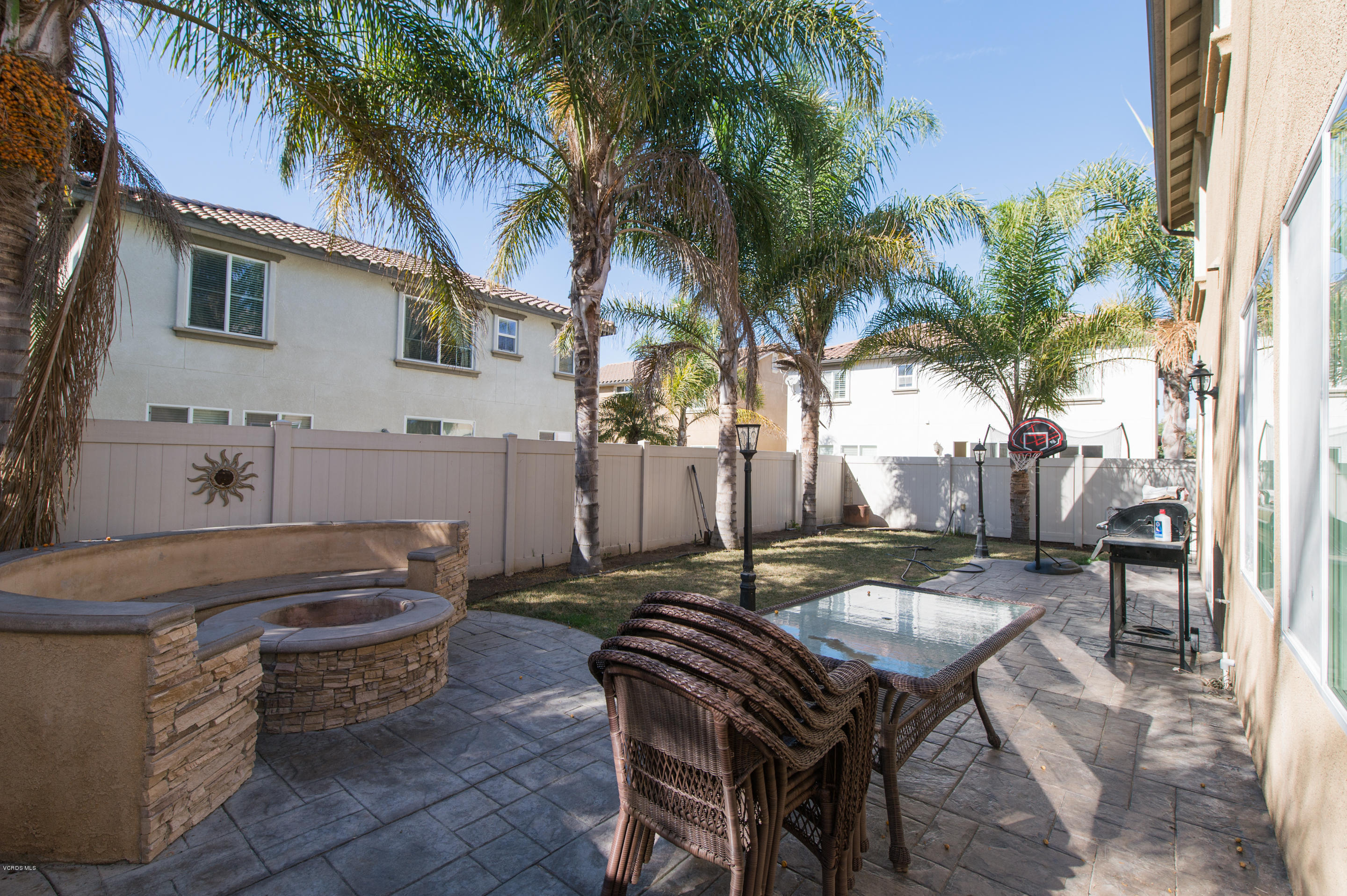 615 Halifax Lane Oxnard, CA 93035 - Photo 11 of 12 a backyard of a house with table and chairs