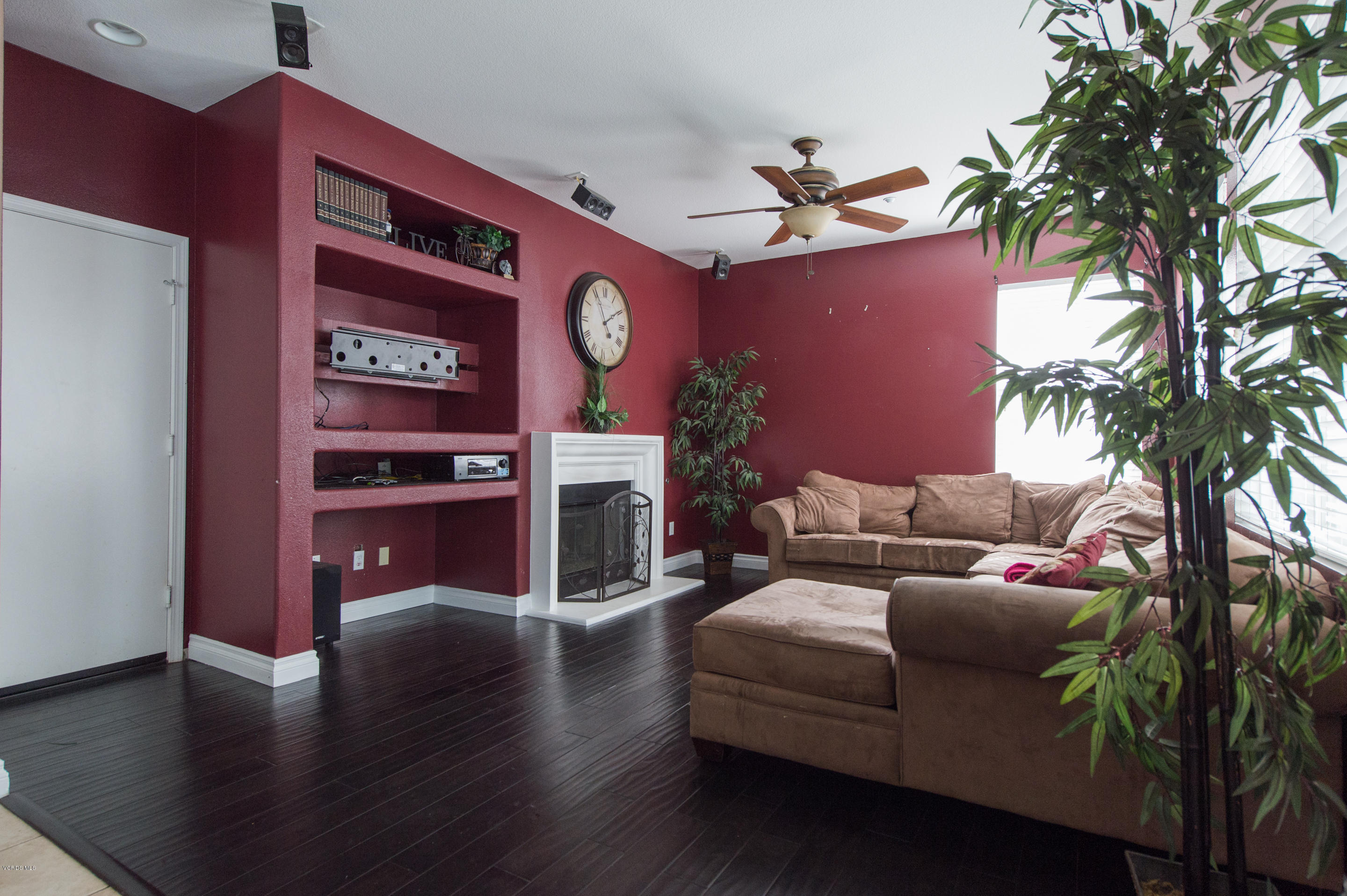 615 Halifax Lane Oxnard, CA 93035 - Photo 6 of 12 a living room with furniture a fireplace and a potted plant
