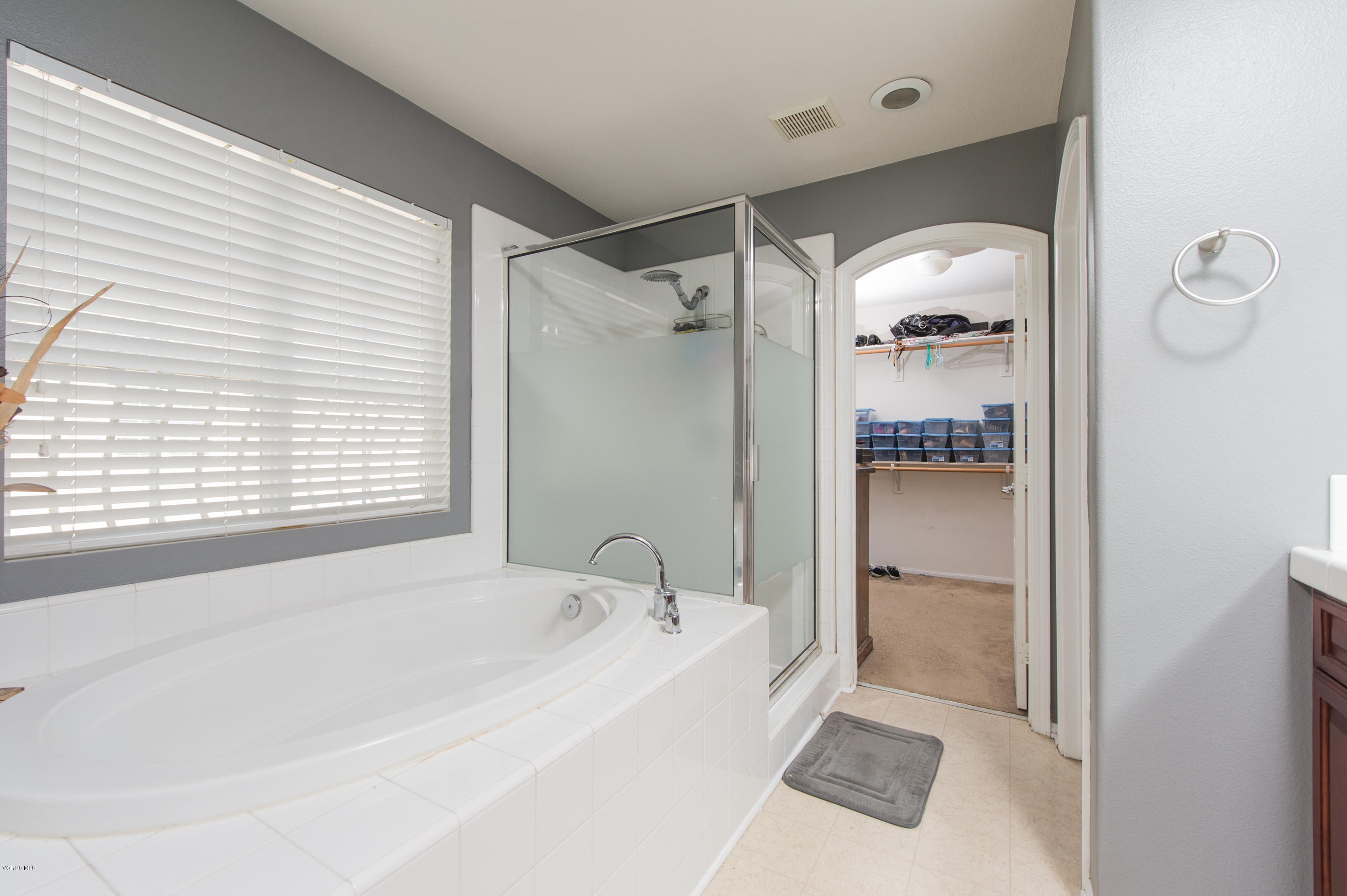 615 Halifax Lane Oxnard, CA 93035 - Photo 9 of 12 a bathroom with a bathtub and a shower