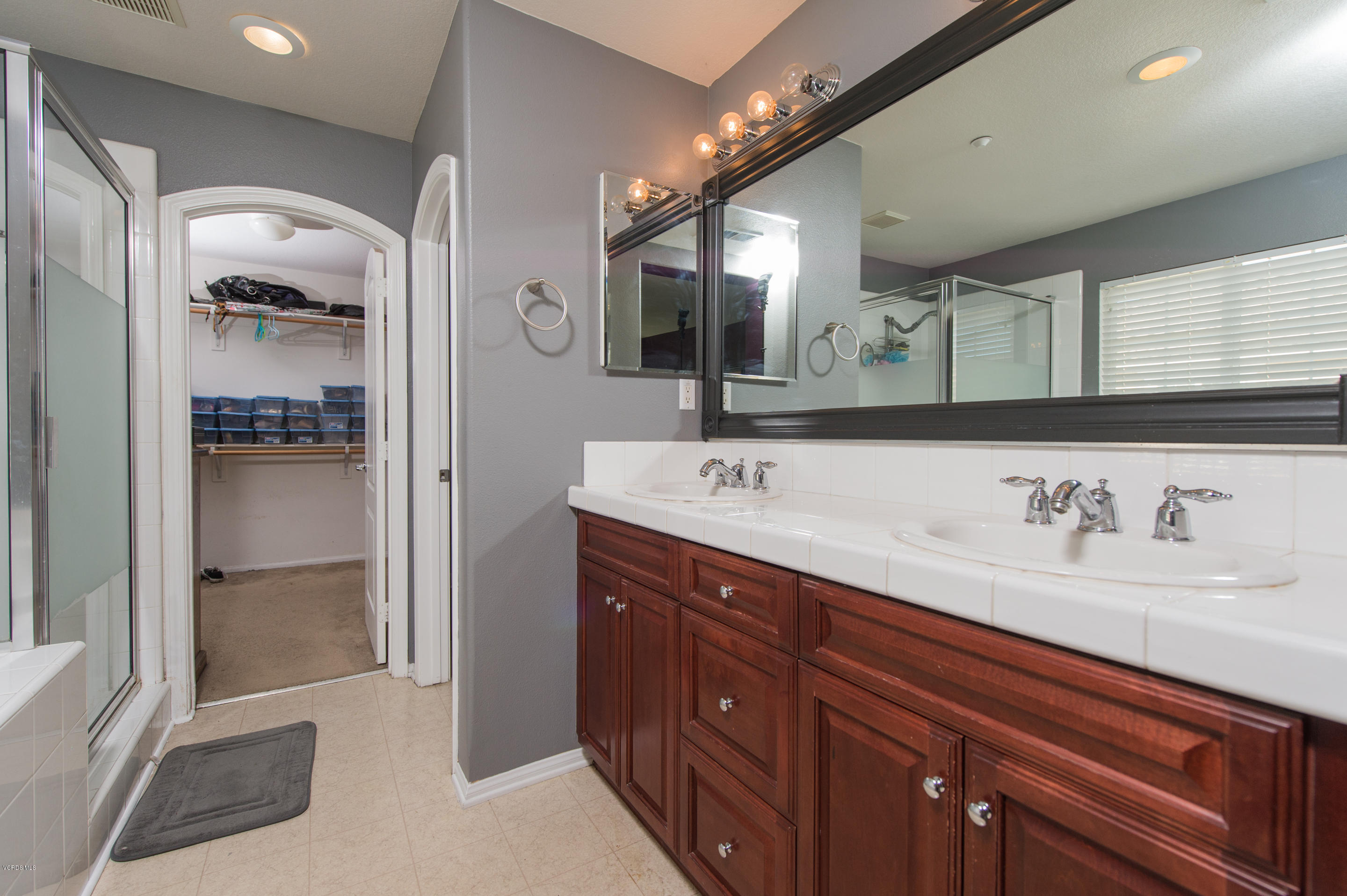 615 Halifax Lane Oxnard, CA 93035 - Photo 10 of 12 a bathroom with a sink a double vanity and shower
