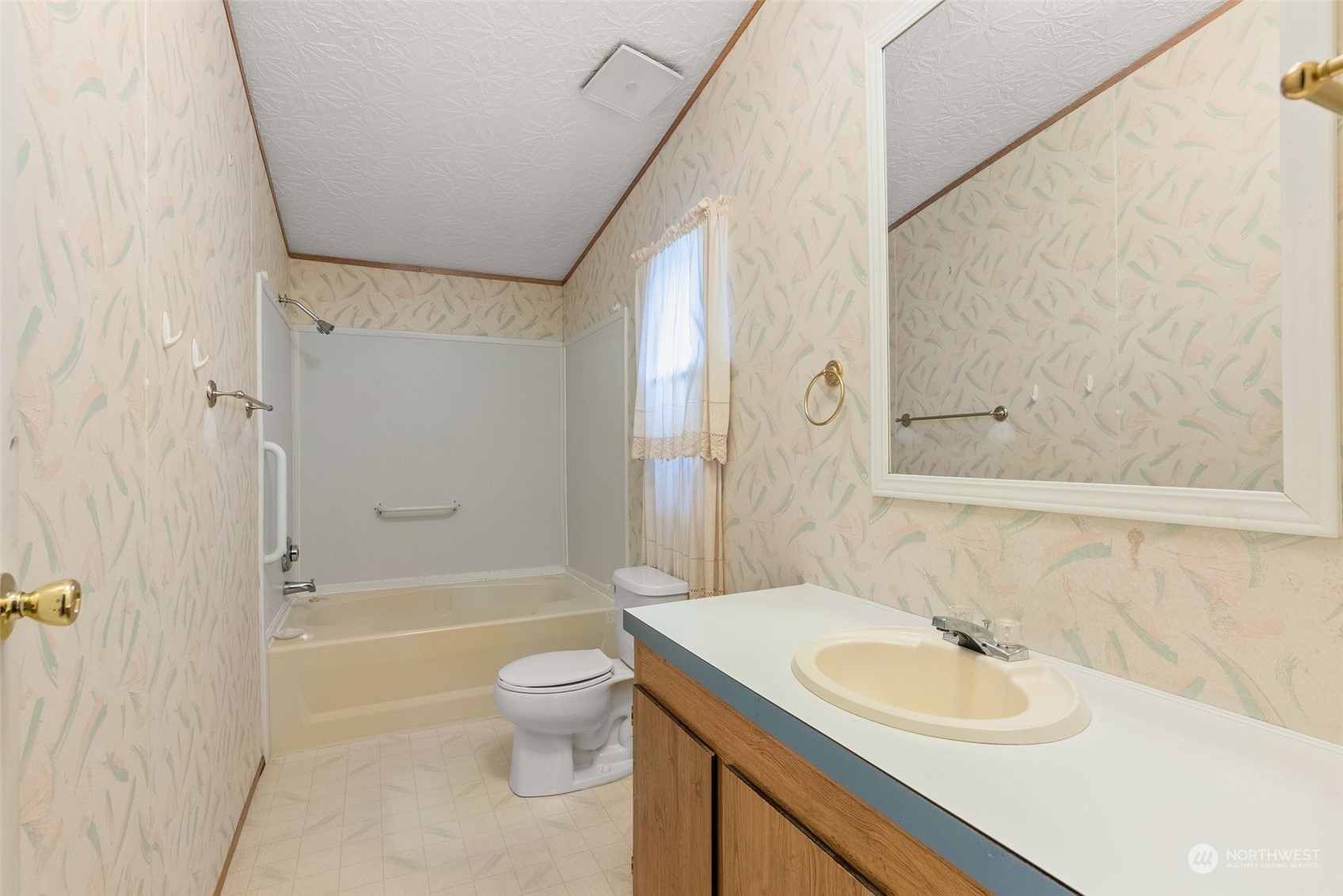 1529 Bishop Road, Unit F Chehalis, WA 98532 - Photo 14 of 21 a bathroom with a sink toilet and shower
