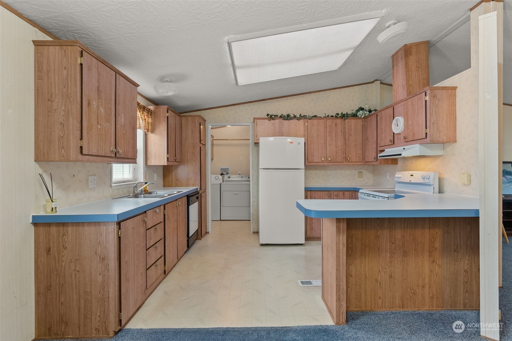 1529 Bishop Road, Unit F Chehalis, WA 98532 - Photo 8 of 21 a kitchen with stainless steel appliances granite countertop a refrigerator a stove and a sink
