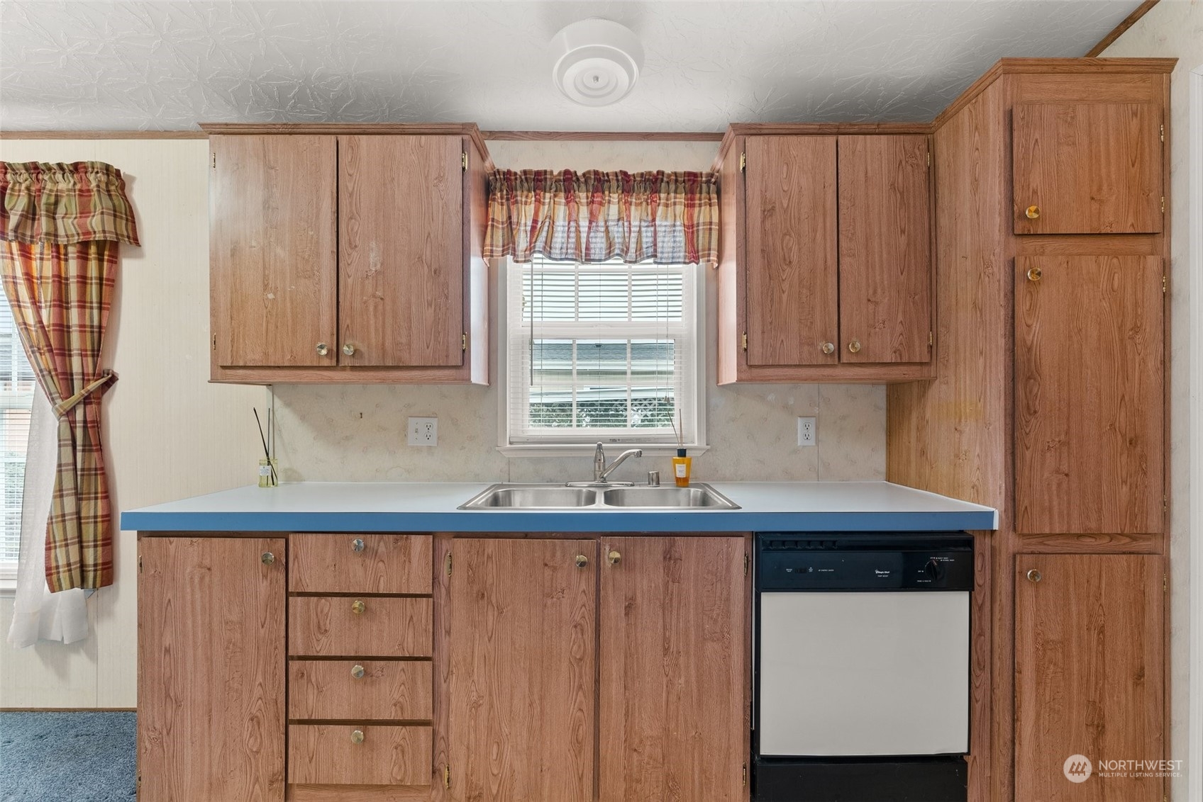 1529 Bishop Road, Unit F Chehalis, WA 98532 - Photo 10 of 21 a kitchen with a sink a window and cabinets