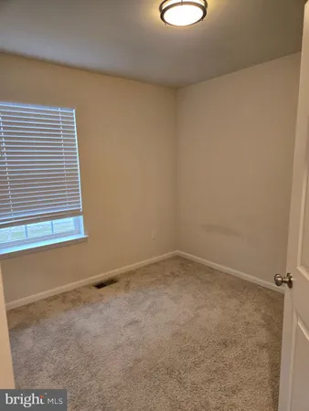 a view of a room with rack on the wall