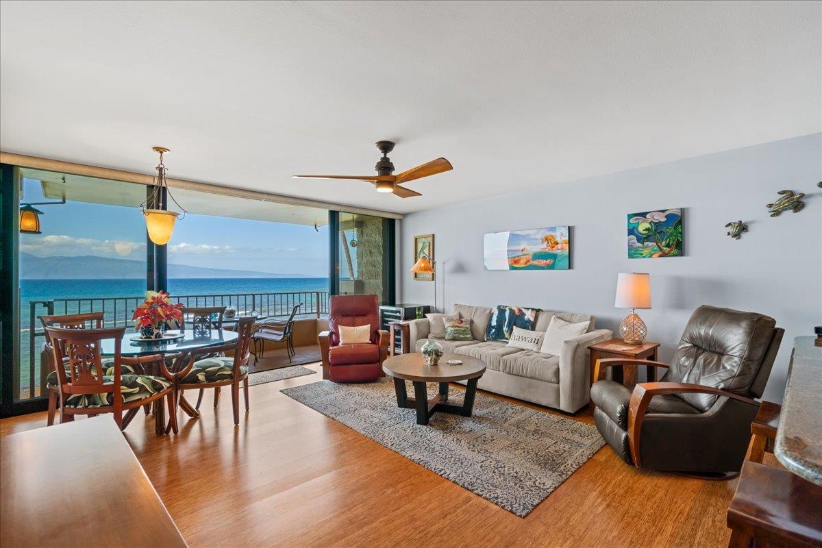 3601 Lower Honoapiilani Road, Unit 201 Lahaina, HI 96761 - Photo 23 of 37 a living room with furniture and wooden floor