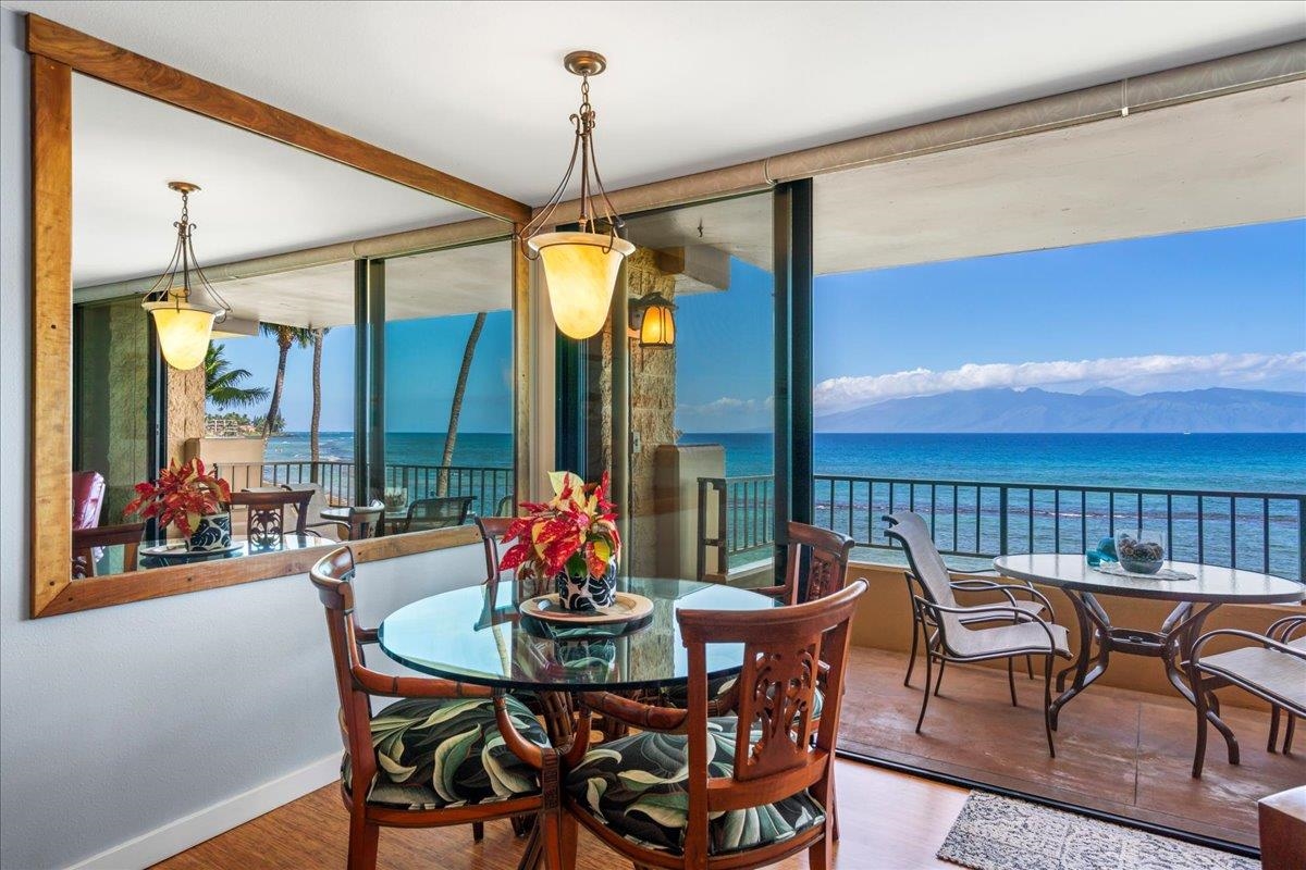 3601 Lower Honoapiilani Road, Unit 201 Lahaina, HI 96761 - Photo 25 of 37 a view of a dining room and furniture window and wooden floor