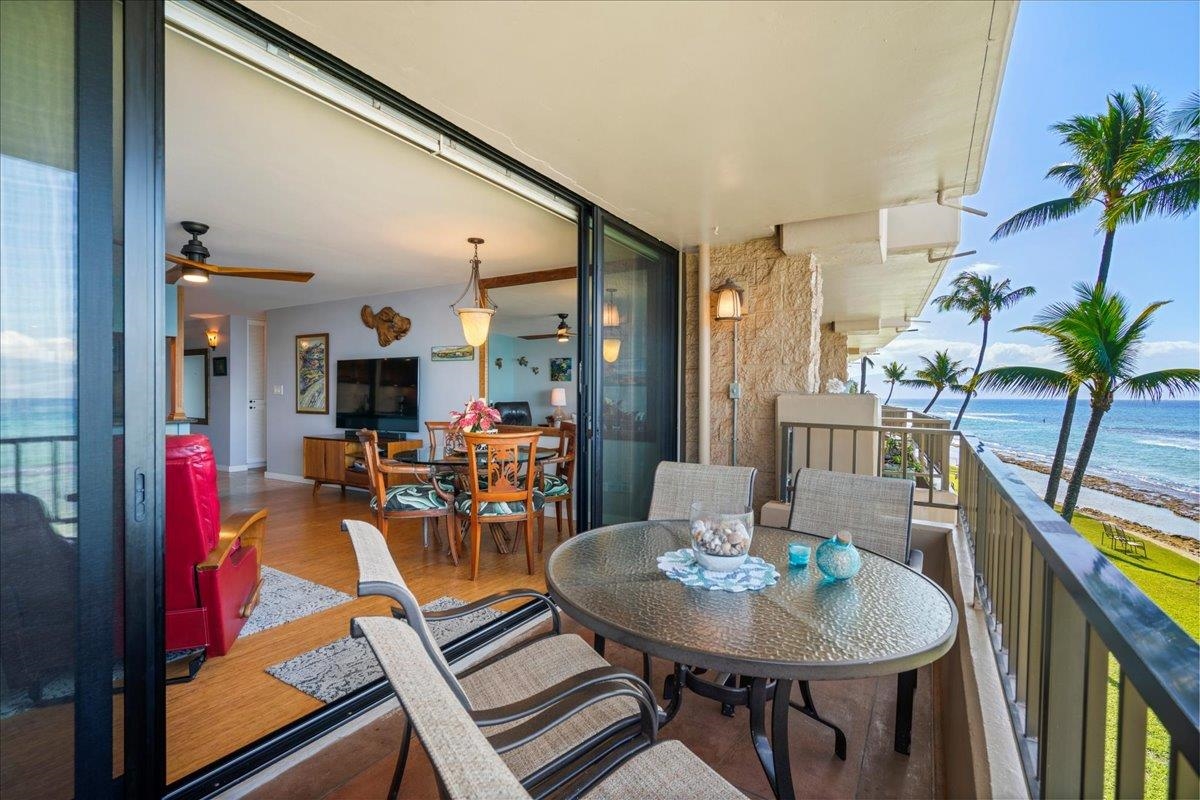 3601 Lower Honoapiilani Road, Unit 201 Lahaina, HI 96761 - Photo 28 of 37 a view of a dining room with furniture and a potted plant