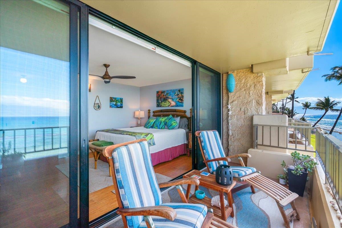 3601 Lower Honoapiilani Road, Unit 201 Lahaina, HI 96761 - Photo 29 of 37 a living room with furniture and a baby crib